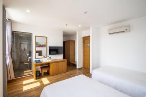 Hai Trieu Hotel客房内的一张或多张床位