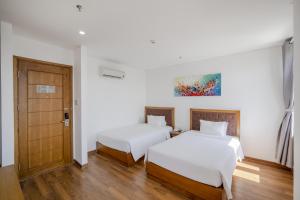 Hai Trieu Hotel客房内的一张或多张床位