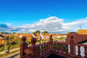 a view of a town from a balcony at Cabin Hill in Colwyn Bay