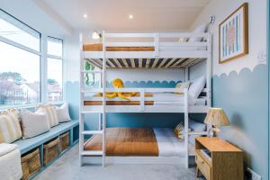 a bunk bed room with two bunk beds at Cabin Hill in Colwyn Bay