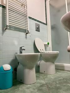 a bathroom with a toilet and a sink at Cervinia Ski In Ski Out - Studio with Terrace in Breuil-Cervinia