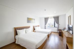 Hai Trieu Hotel客房内的一张或多张床位
