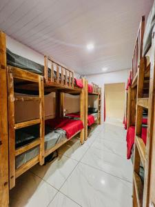 a room with several bunk beds in it at The Last Try - Secret Ashram Coorg in Siddapur
