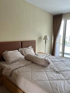 Katil atau katil-katil dalam bilik di Apartment Thamrin City Nagoya +3 gambar