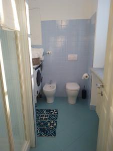 a bathroom with a toilet and a bidet at Lovely apartment with terrace by Alterego in Villanova dʼAsti