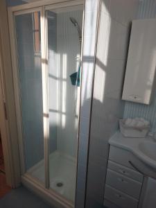 a bathroom with a shower and a sink at Lovely apartment with terrace by Alterego in Villanova dʼAsti
