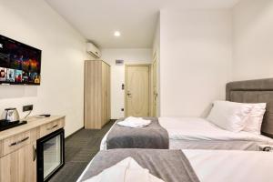 Ένα ή περισσότερα κρεβάτια σε δωμάτιο στο Hub Inn Pera