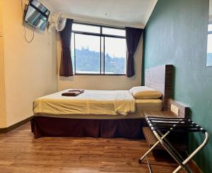 Postel nebo postele na pokoji v ubytování Parkland Hotel
