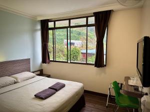 Postel nebo postele na pokoji v ubytování Parkland Hotel