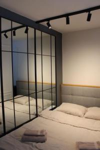 Voodi või voodid majutusasutuse Jahorina Apartman Benvenuti toas