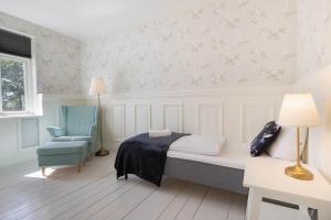 Voodi või voodid majutusasutuse Velling Koller Hotel og Camping toas