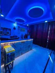 a bar in a room with a blue ceiling at HOTEL S S PALACE in Agra