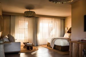 A bed or beds in a room at Swell Hotel Byron Bay - Adults Only