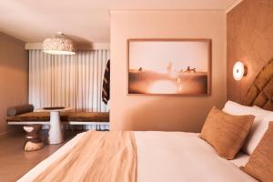 A bed or beds in a room at Swell Hotel Byron Bay - Adults Only