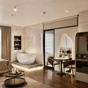 a living room with a bath tub and a bathroom at Homestay Smart - Vinhomes Tu Liem Ha Noi in Hanoi