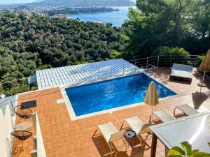 a swimming pool on top of a house at Skiathos Gea Villas in Achladies