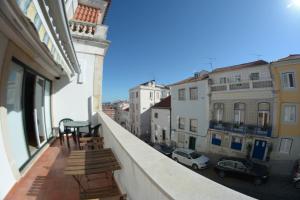 an apartment balcony with a view of a city at Fado Bed & Breakfast - Santos in Lisbon