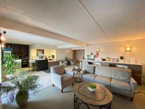 a living room with a couch and a table at Superior Stay Hotel in Marquette