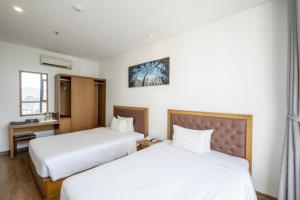 Hai Trieu Hotel客房内的一张或多张床位