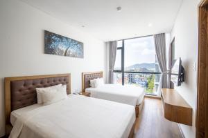 Hai Trieu Hotel客房内的一张或多张床位