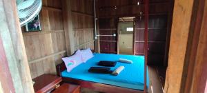 Voodi või voodid majutusasutuse Tree Trails Homestay & Offers Jungle Trekk-Scooter For Rental toas