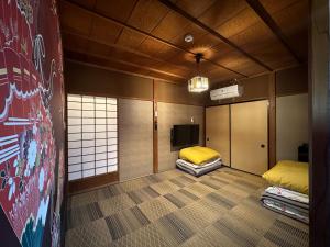 Postel nebo postele na pokoji v ubytování ビーチハウス沼津Beach house numazu ビーチ至近