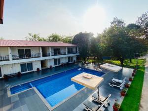 an aerial view of a hotel with a swimming pool at The Green Jungle Resort in Karjat