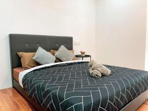 En eller flere senge i et værelse på Luxury Homestay, MahkotaCheras, Gaming, Gathering