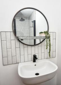a bathroom with a sink and a mirror at The Cranny 2 Bed House in Central Morpeth in Morpeth +12 photos