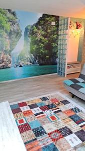 a room with a wall mural of a mountain at Safta Apartaments in Câmpulung
