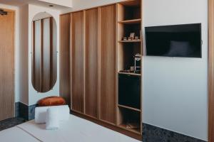 TV a/nebo společenská místnost v ubytování Hotel Moderne