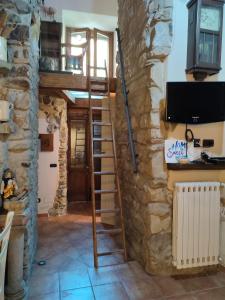 TV a/nebo společenská místnost v ubytování La Grotta del Leone