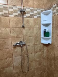 a shower with a hose in a bathroom at Mária in Košice