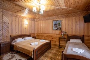 Letto o letti in una camera di Sadyba u Halyny