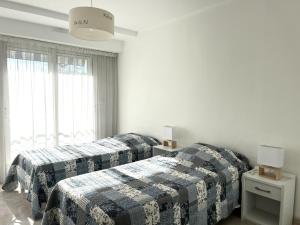 Posteľ alebo postele v izbe v ubytovaní Spacieux appartement dans le centre-ville des Sables d'Olonne - 4 pers
