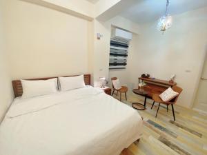 Letto o letti in una camera di 澎湖卡米諾民宿ll住宿接駁ll貓店長