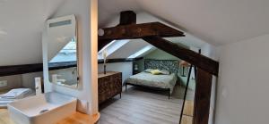 a bathroom with a sink and a mirror in a room at Bleautiful "Blanche" Charmant duplex tout confort in Fontainebleau