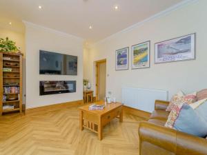 a living room with a couch and a coffee table at 1 Bed in Llandudno 83621 in Llandudno