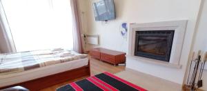 A bed or beds in a room at New Inn