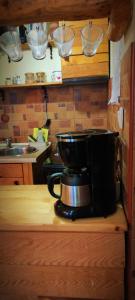a coffee maker sitting on a counter in a kitchen at Uki & Sofi mountain house in Kopaonik