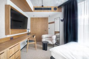 Postel nebo postele na pokoji v ubytování Qubus Hotel Katowice