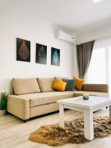 a living room with a couch and a table at Luxury 1 Bed in Longbeach in Iskele