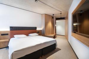 Postel nebo postele na pokoji v ubytování Qubus Hotel Katowice