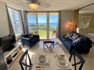 a living room with a couch and a table at EBT 302b in Fort Myers Beach