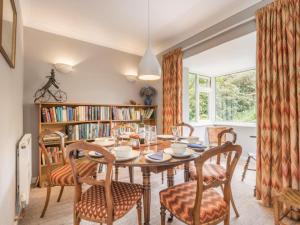 a dining room with a table and chairs at 3 Bed in Portinscale SZ528 in Portinscale