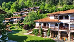 a row of houses in a mountain village at Spa Hotel Ismena in Devin