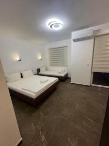 Voodi või voodid majutusasutuse Nego apartmani toas