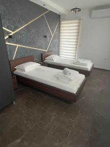 Voodi või voodid majutusasutuse Nego apartmani toas