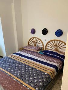 a bedroom with two beds with blue comforters at Teobaldo Power in Puerto de la Cruz