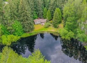 an aerial view of a house next to a lake at Private Lake House in Puyallup